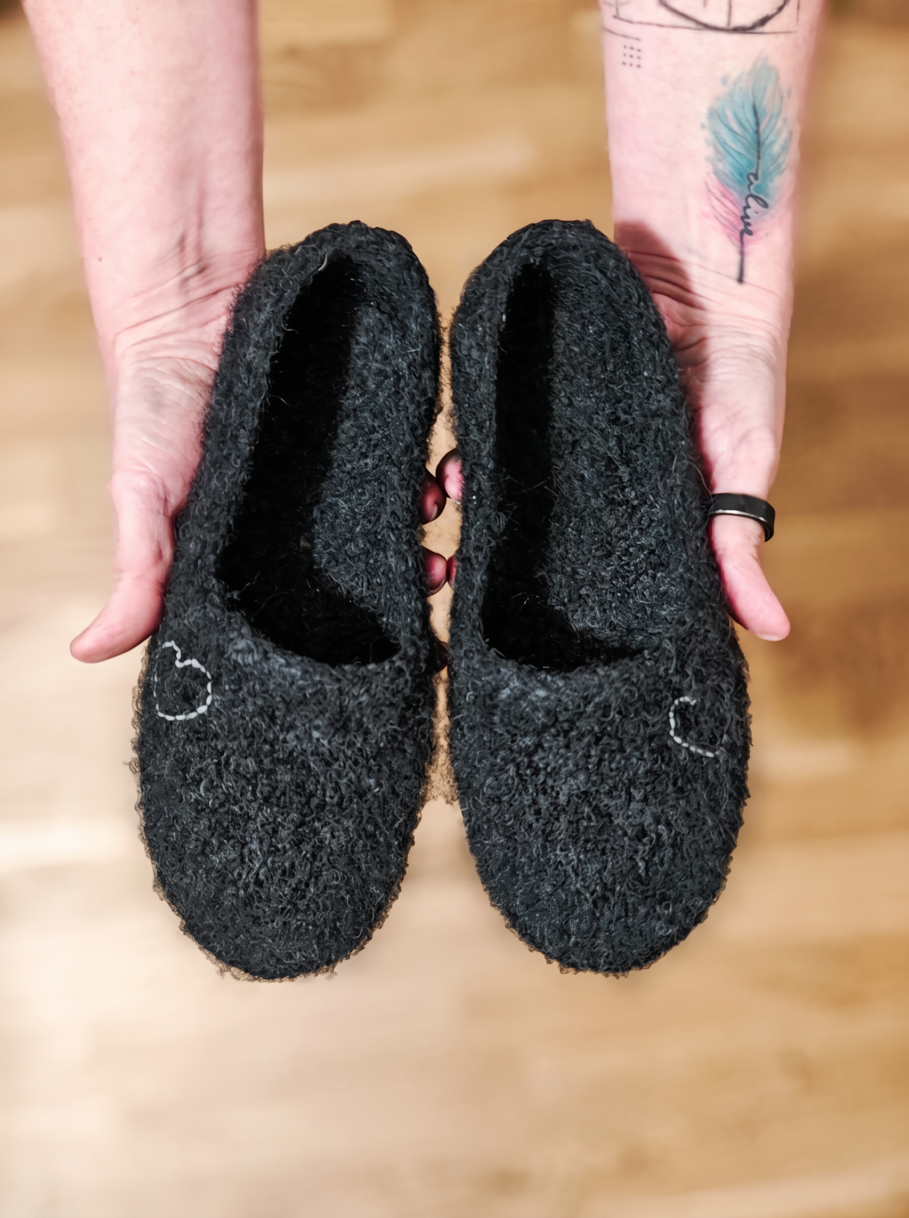 Hand-knitted wind grey wool slippers with an embroidered heart